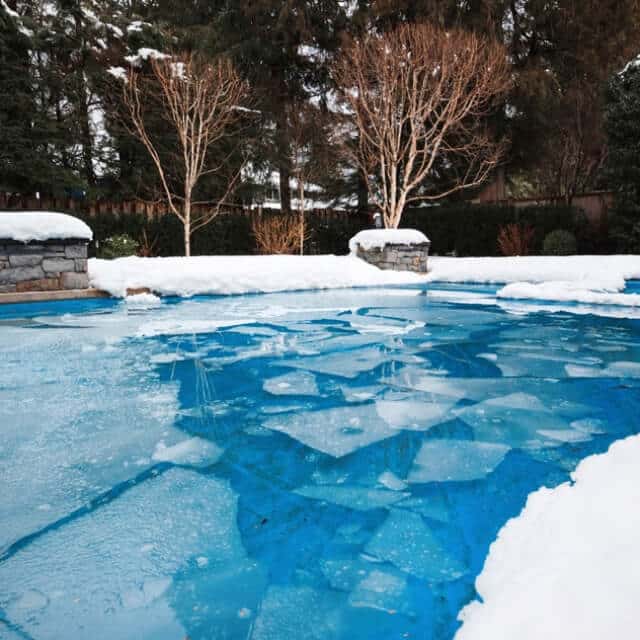 In-ground backyard pool in the winter
